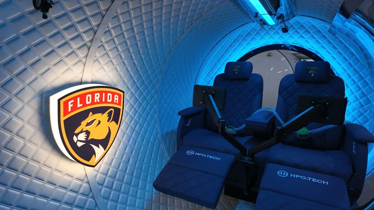 Inside a Florida Panthers chamber - reclining seats and screens